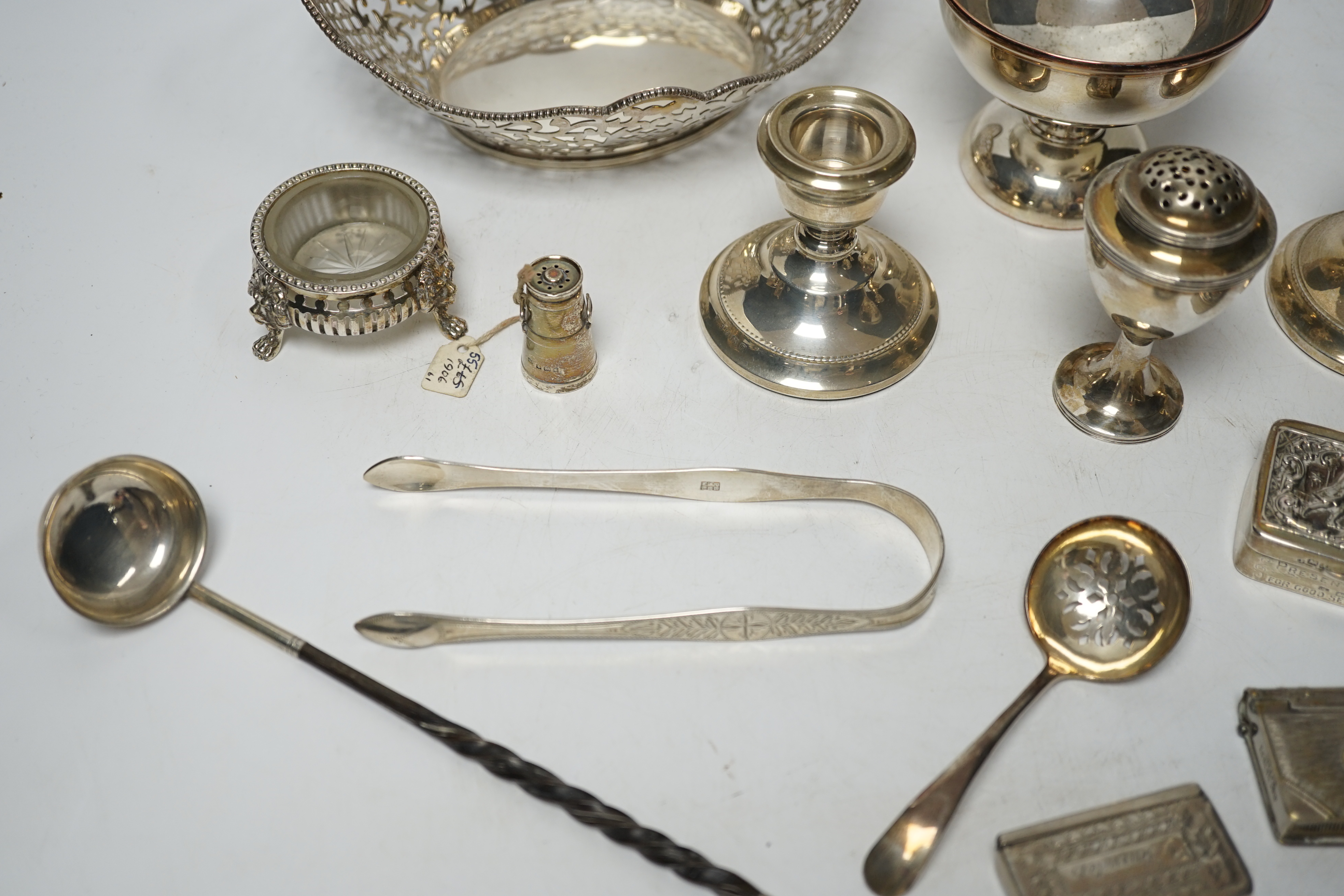 A small quantity of silver items to include a presentation snuff box, Chester, 1901, 69mm, vesta cases, condiments including 'milk churn' pepperette, George III vase shaped pepperette, ring box modelled as a coal scuttle